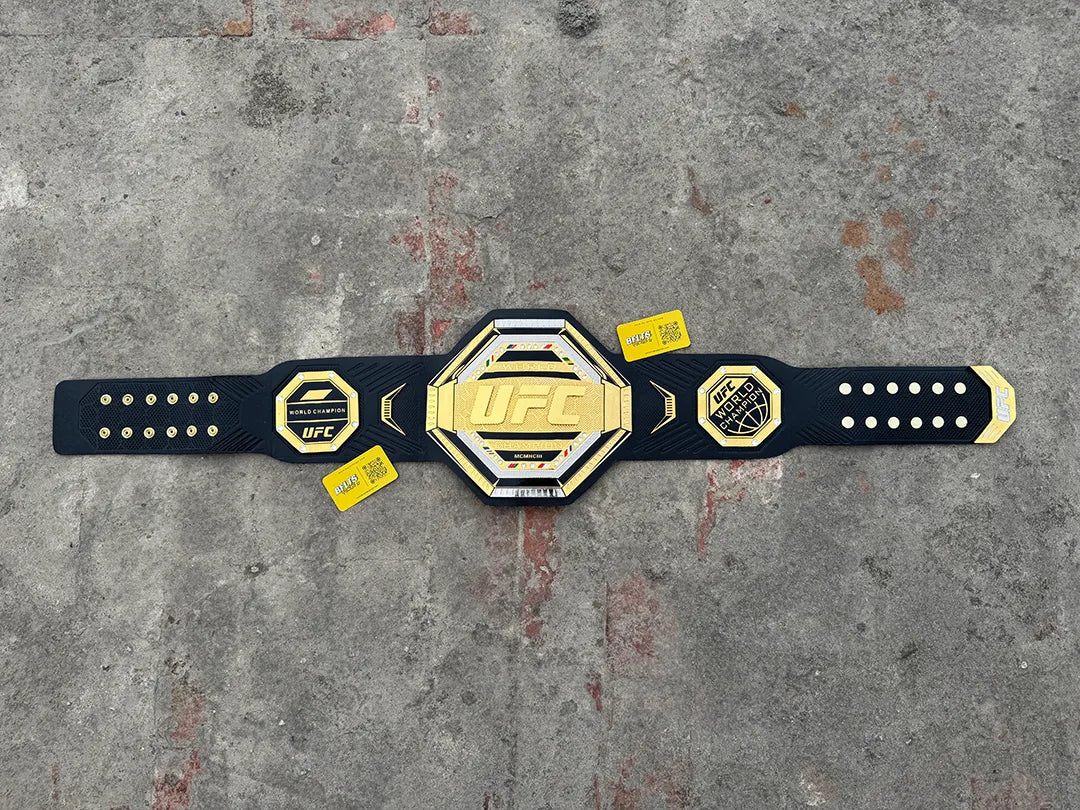 UFC Legacy Championship Belt replica full flat lay view showing complete length, gold plates and black strap