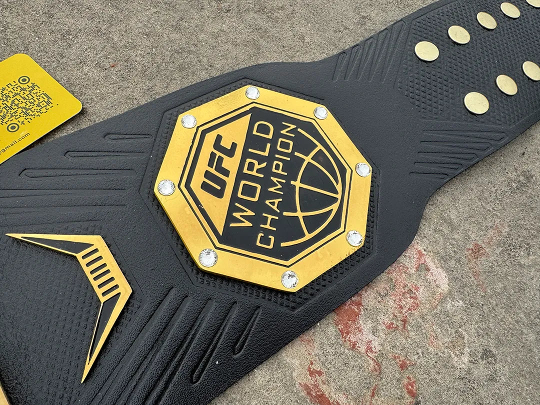 UFC Legacy Championship Belt right side plate macro shot, globe design gold black octagon with rhinestone accents