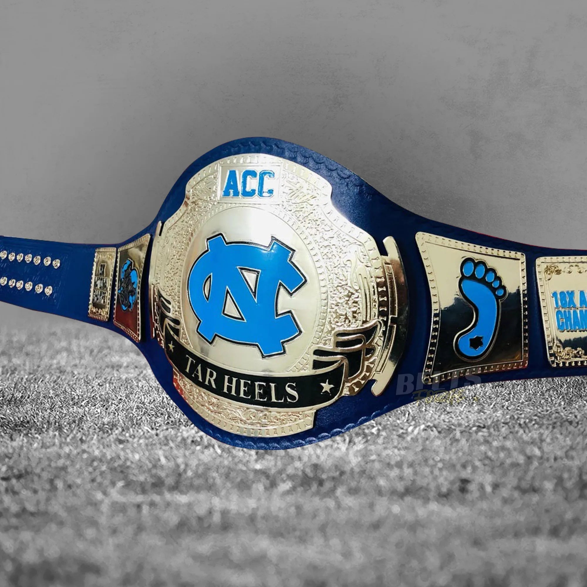 UNC Tar Heels ACC Championship Belt angled right profile showing center and side plates on genuine leather strap