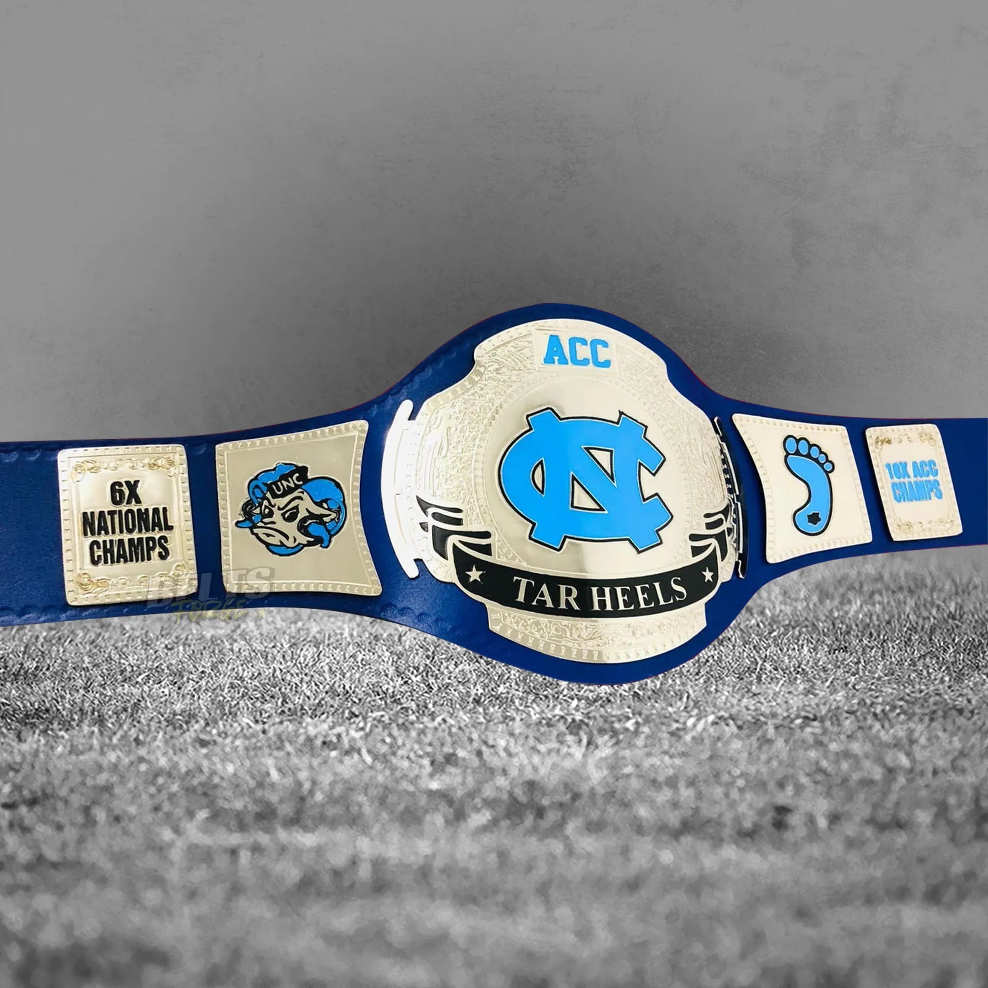 UNC Tar Heels ACC Championship Belt front angled display view showing all gold-plated brass plates