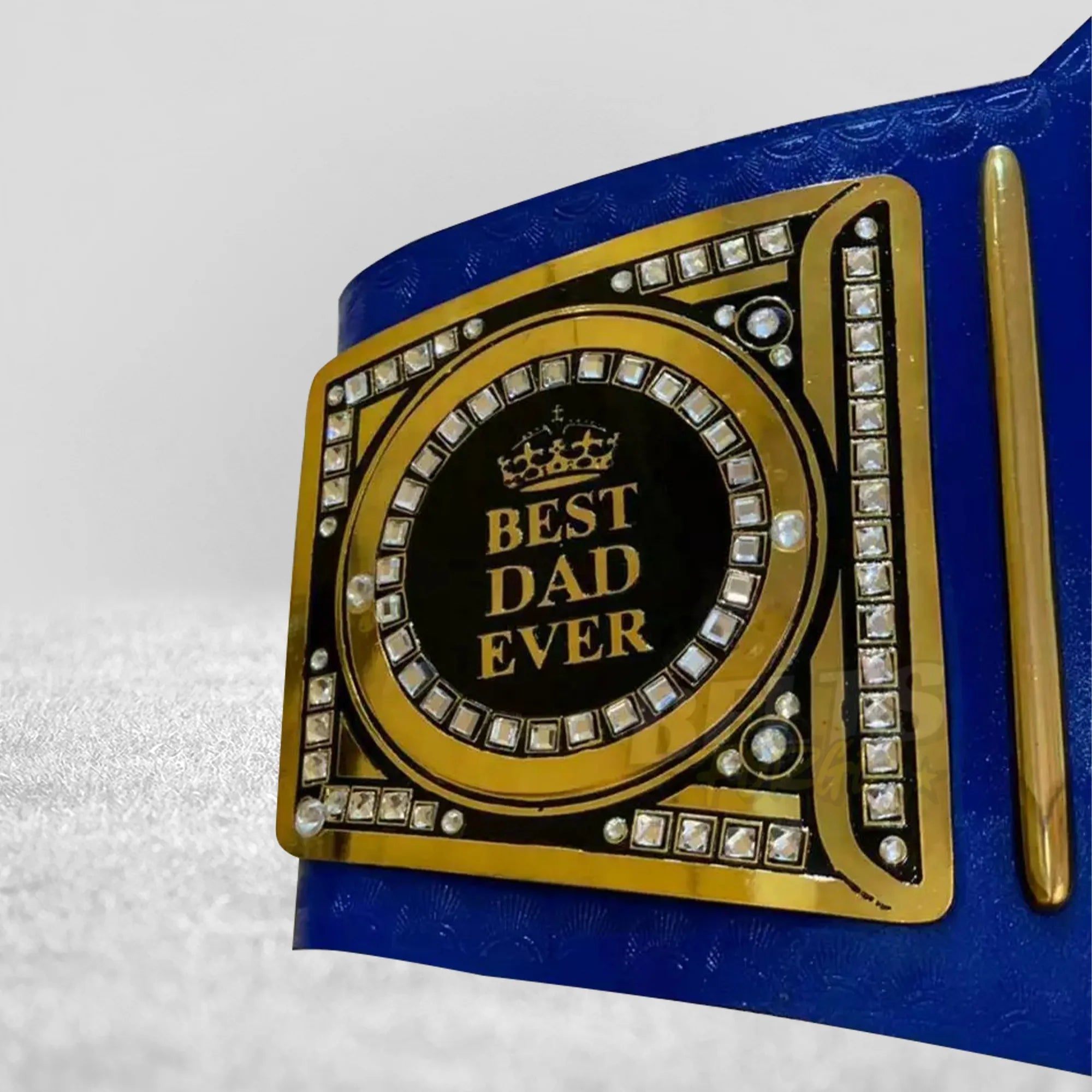 World's Greatest Dad Championship Belt side plate detail showing gold-plated brass side plate on genuine blue leather strap
