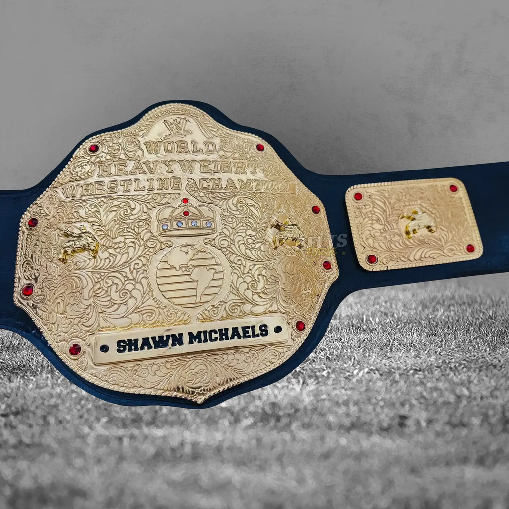 Big Gold Belt World Heavyweight Championship center plate angled close-up showing CNC-engraved gold-plated brass globe medallion detail