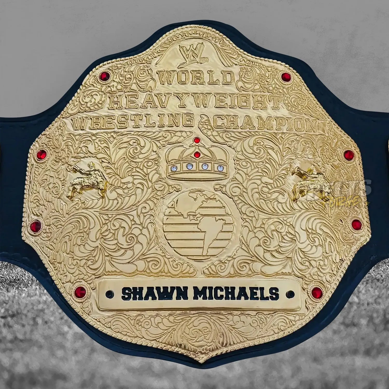 Big Gold Belt World Heavyweight Championship center plate close-up showing CNC-engraved gold brass globe medallion and world champion inscription