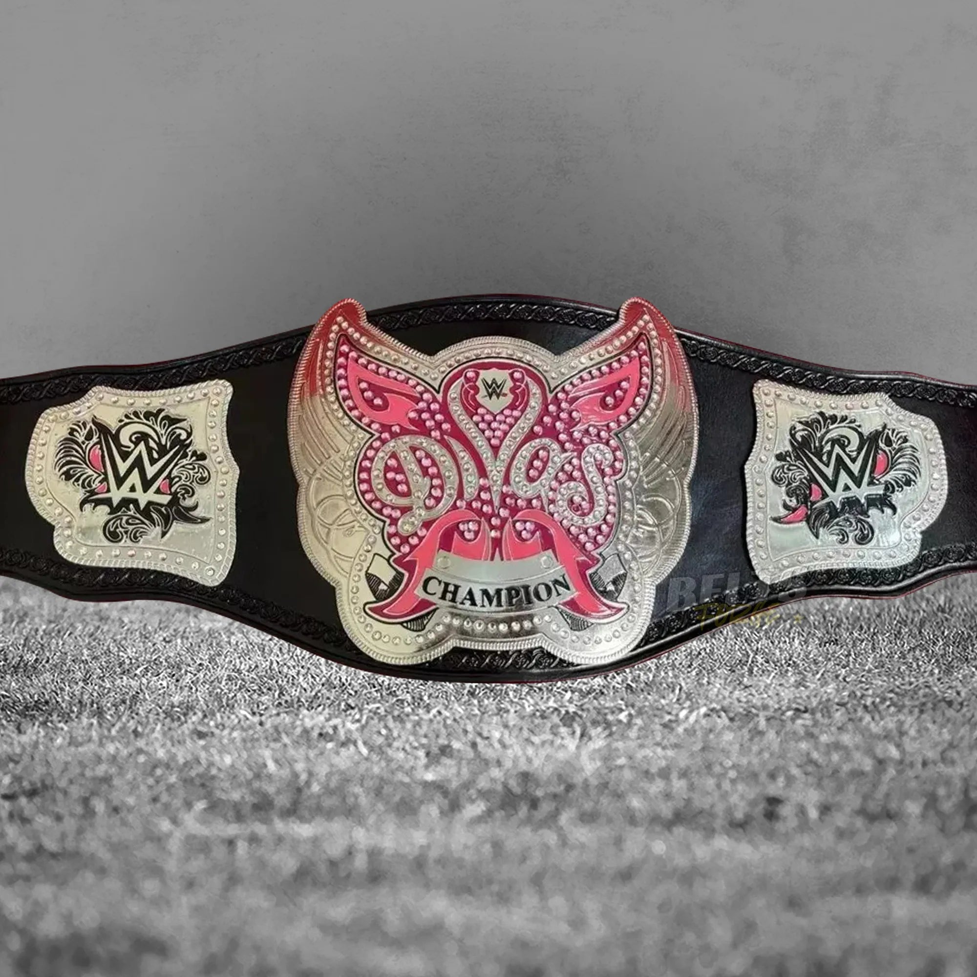 Divas Women's Championship Belt silver replica angled front view showing silver-plated brass main plate and rhinestone crystal detail