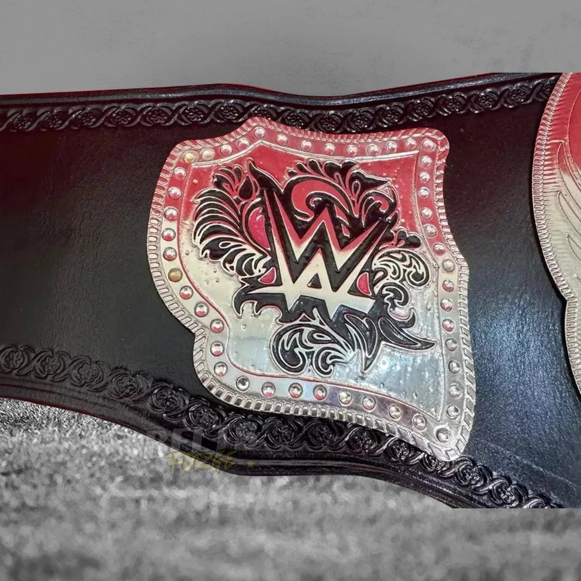 Divas Women's Championship Belt left side plate close-up showing silver-plated brass side plate with rhinestone accents on leather