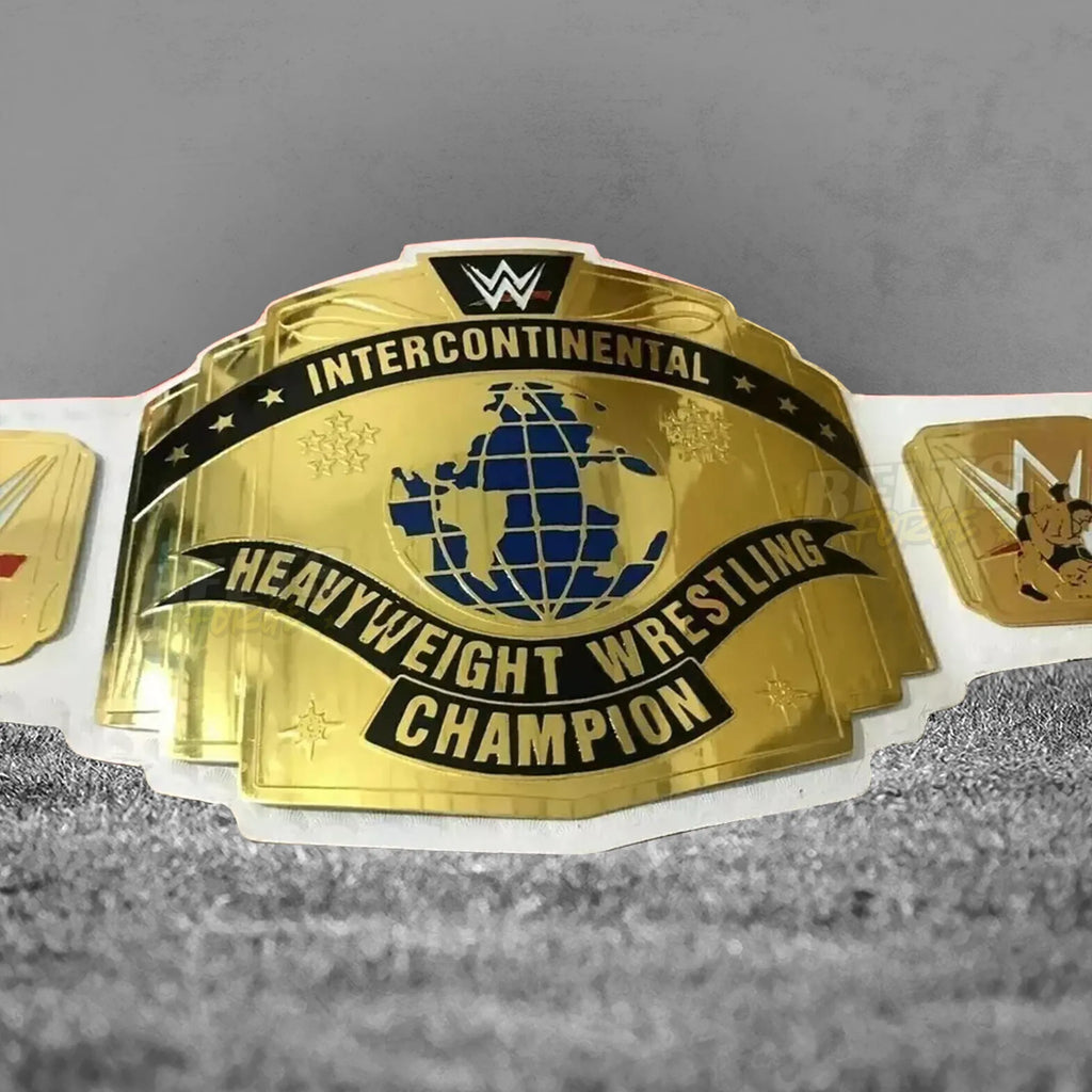 Intercontinental Championship Belt white strap center plate close-up showing CNC-engraved gold-plated brass IC championship design