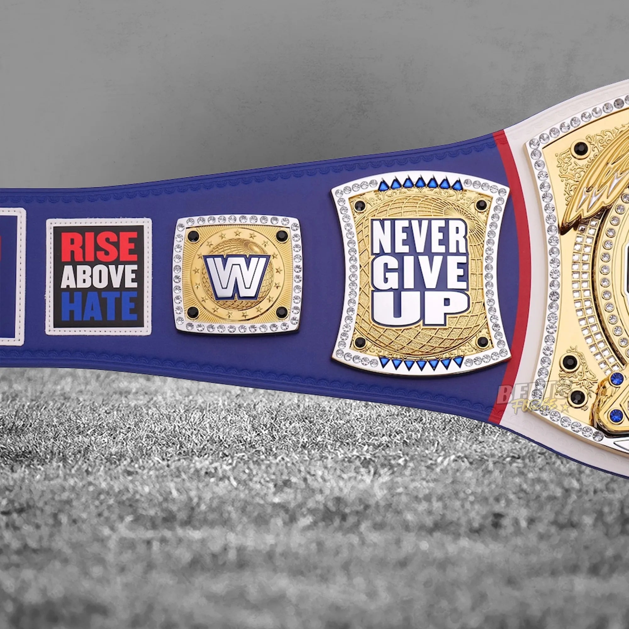 John Cena New Jersey Spinner Championship Belt Never Give Up side plate detail showing gold-plated brass Never Give Up motto plate