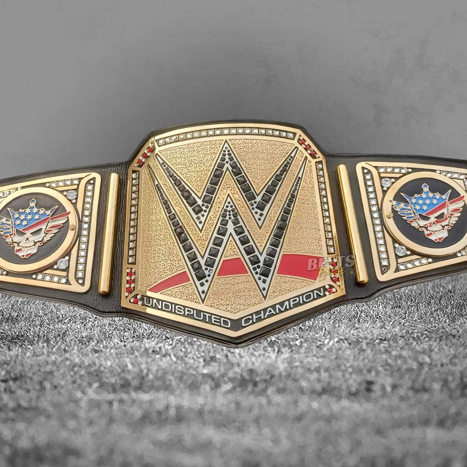 Cody Rhodes American Nightmare Undisputed Championship Belt full front view showing complete gold-plated brass Undisputed plates on leather strap