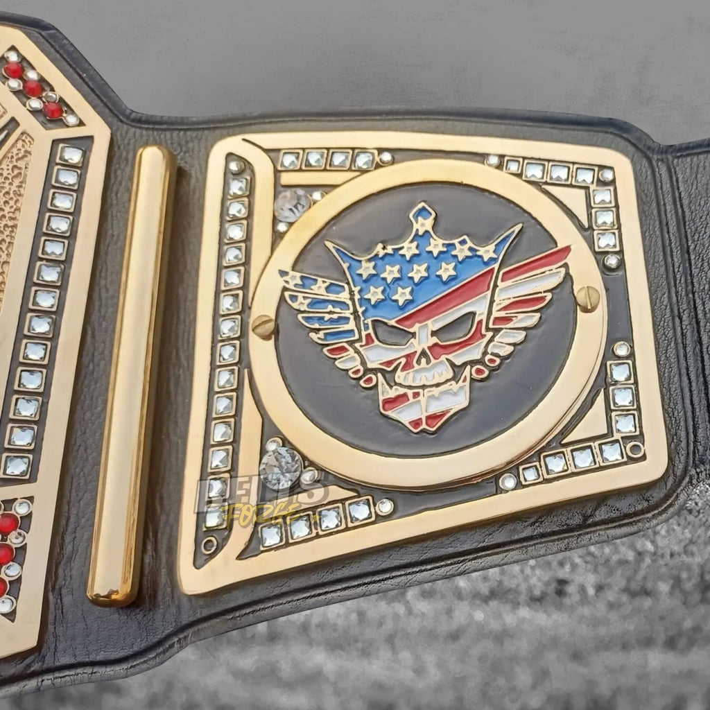 Cody Rhodes American Nightmare championship belt right skull logo side plate close-up showing gold-plated American Nightmare skull engraving