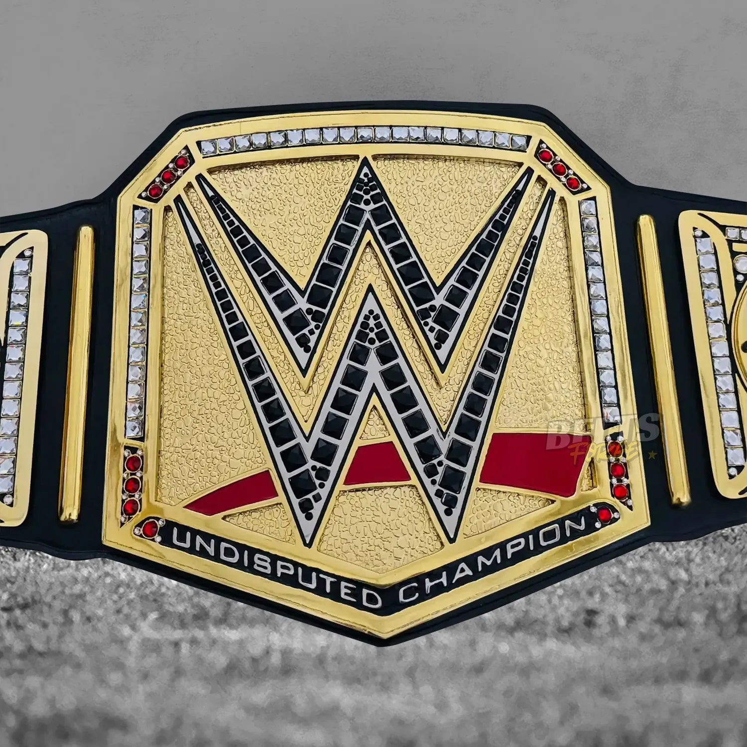John Cena Undisputed Championship Farewell 2025 Belt center plate close-up showing CNC-engraved gold-plated brass Undisputed design