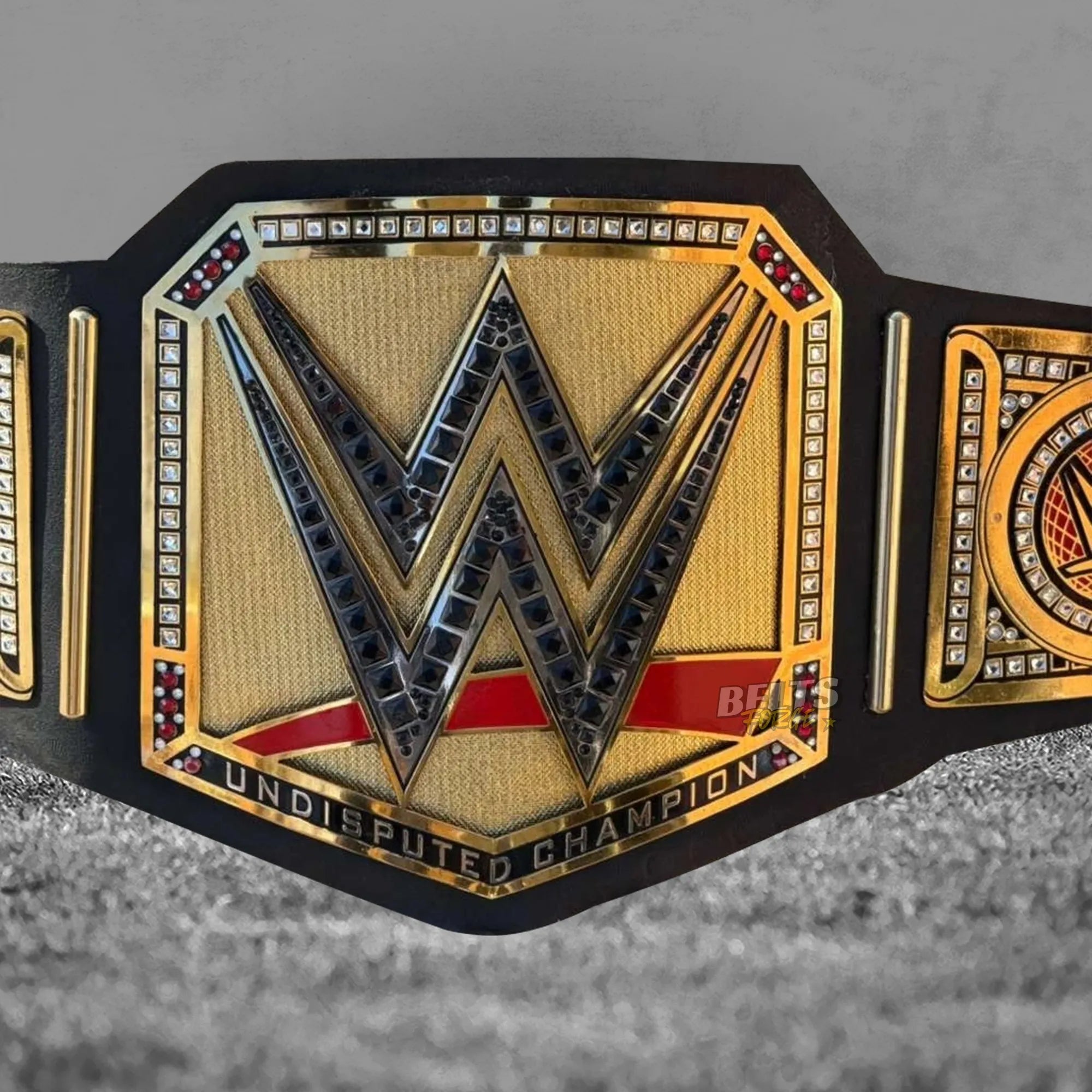 Undisputed Championship Belt gold version center plate close-up showing Undisputed Champion text detail