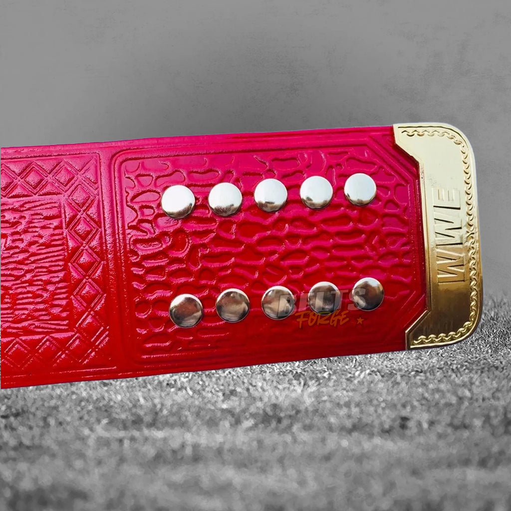 Pink Universal Championship Belt alternate strap rivet detail showing gold stud pattern on genuine pink leather close-up