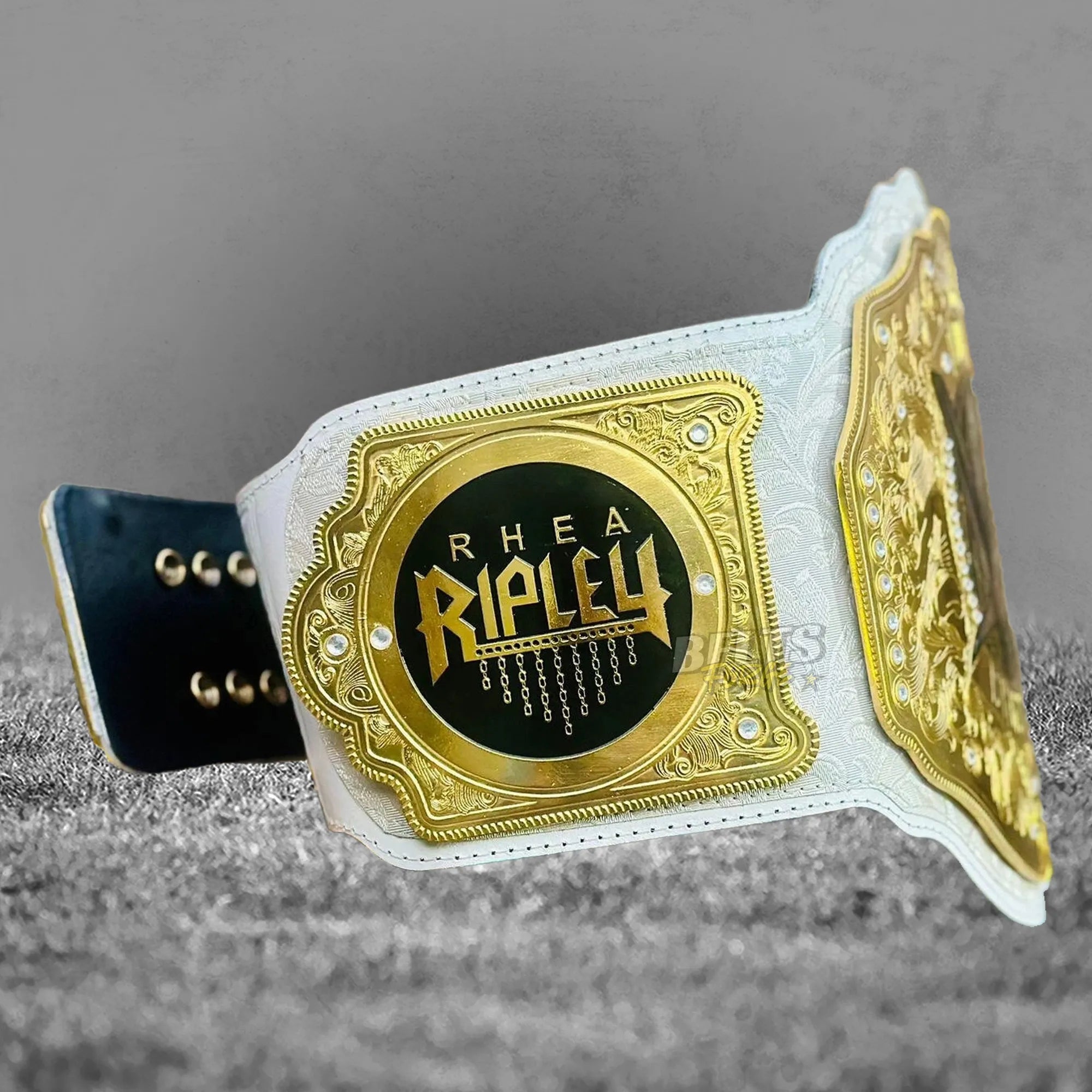 Rhea Ripley Women's World Championship Belt side angle view showing gold plates and genuine leather strap profile