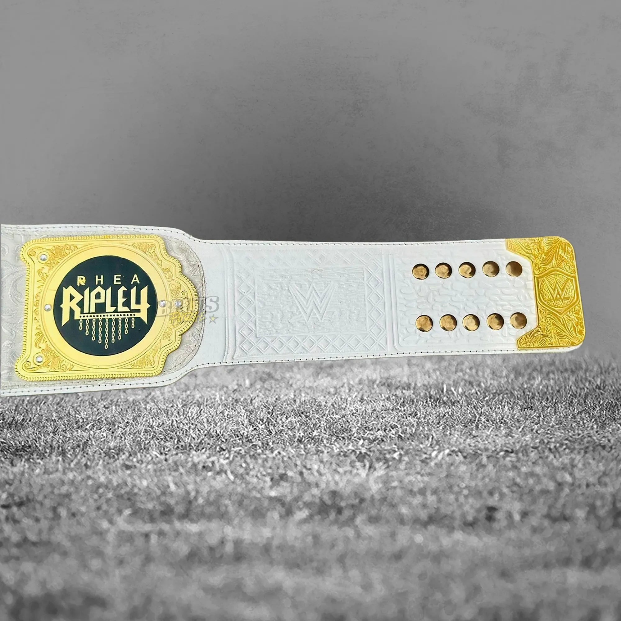 Rhea Ripley championship belt strap detail showing genuine leather strap with gold hardware close-up by Belts Forge