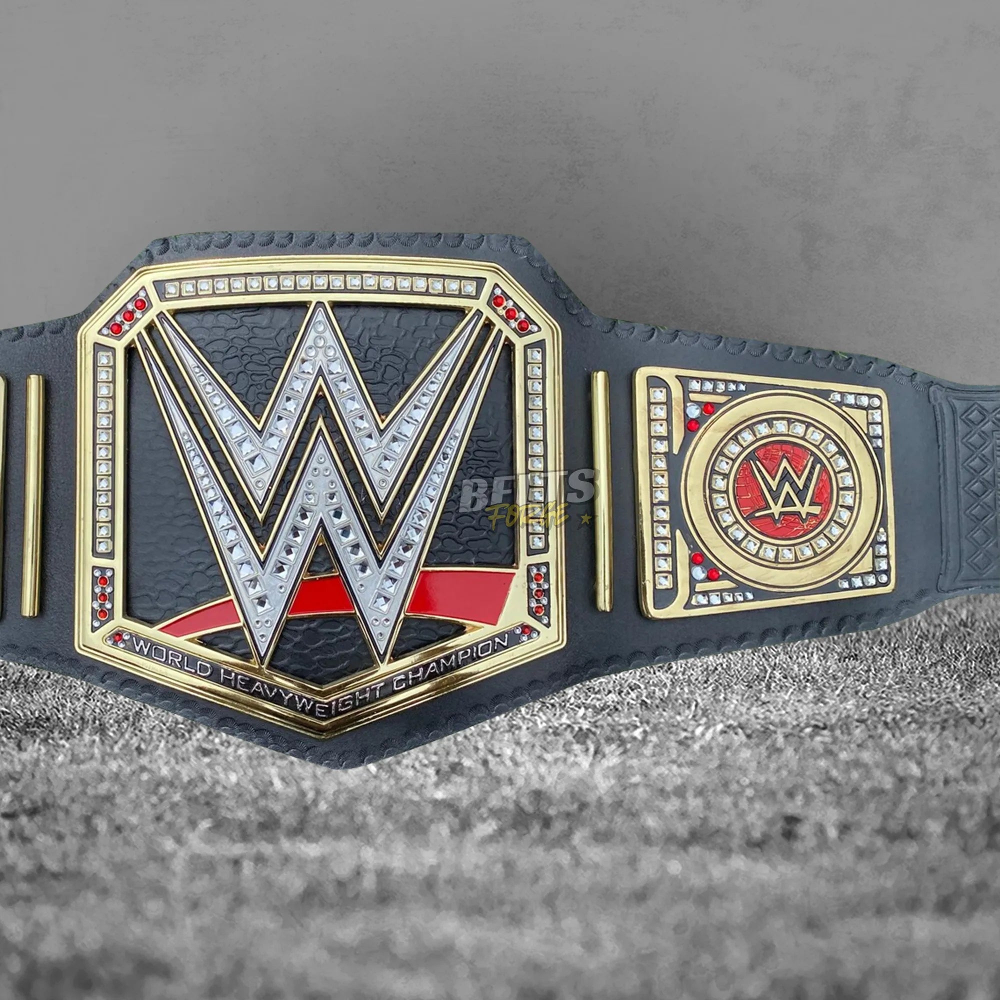 World Heavyweight Championship Belt angled front view showing solid brass center plate and right side plate detail