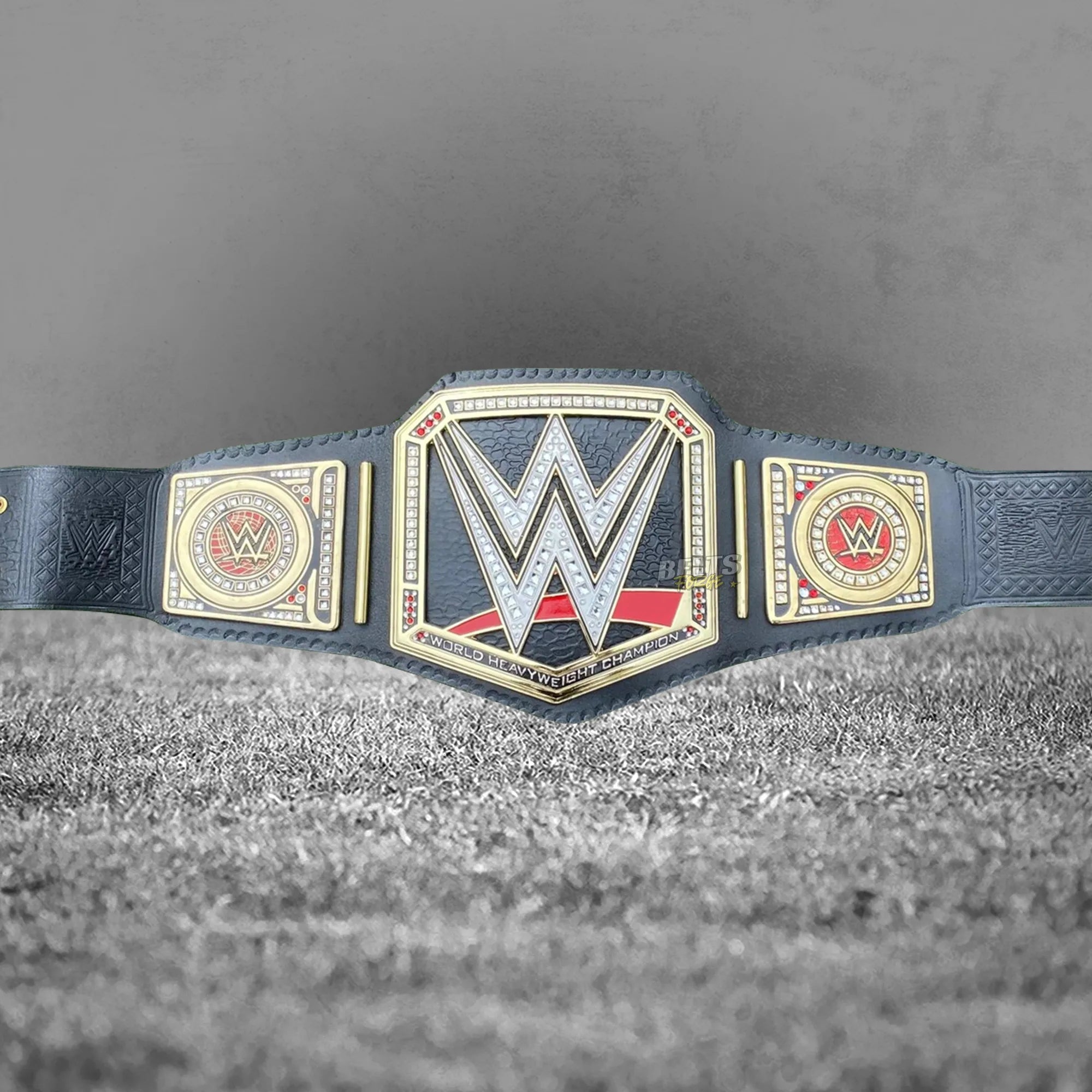 World Heavyweight Championship Belt front display center plate angled close up showing solid brass gold plating