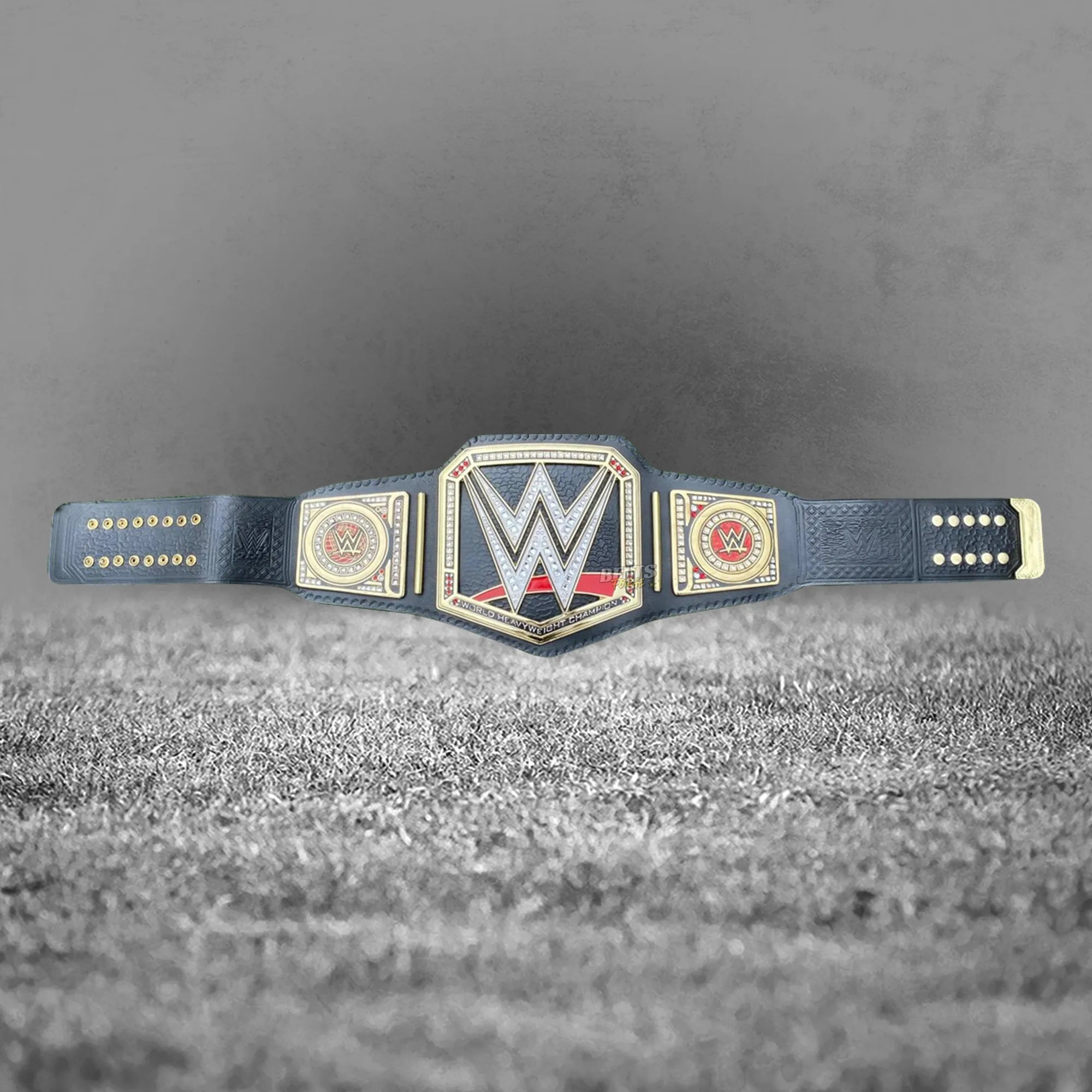 World Heavyweight Championship Belt full flat lay display view showing complete solid brass plates on leather strap