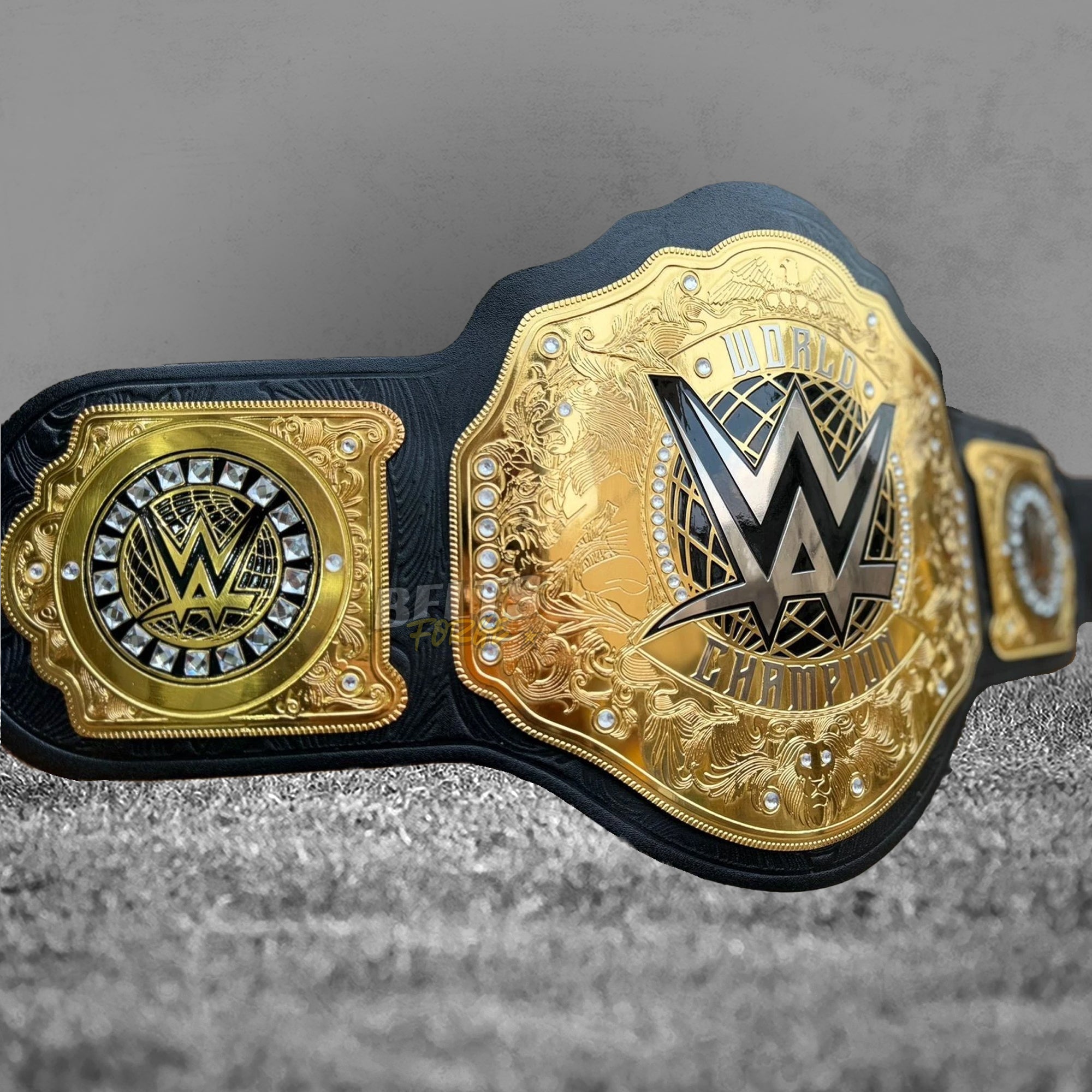 WWE World Heavyweight Championship Belt replica angled right view showing gold WWE World Champion plate and right square side plate with WWE globe logo and crystal accents