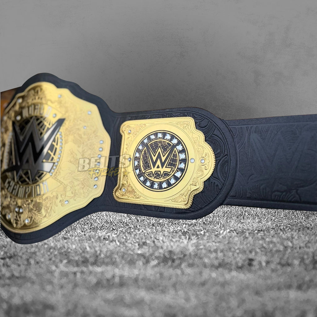 WWE World Heavyweight Championship Belt left side plate close-up showing gold-plated square plate with WWE globe logo surrounded by crystal rhinestone accents