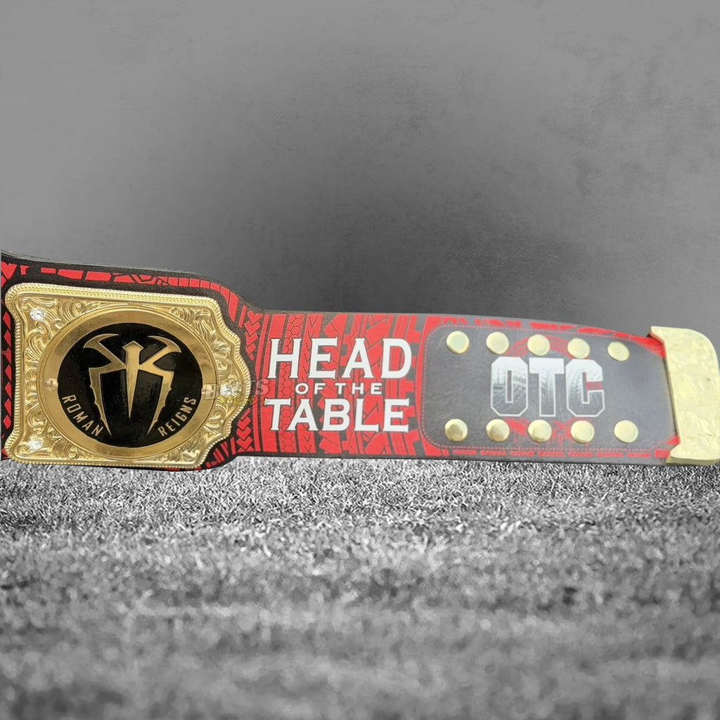 Roman Reigns championship belt center and side plate detail, gold tribal brass main plate with OTC side plates on printed leather