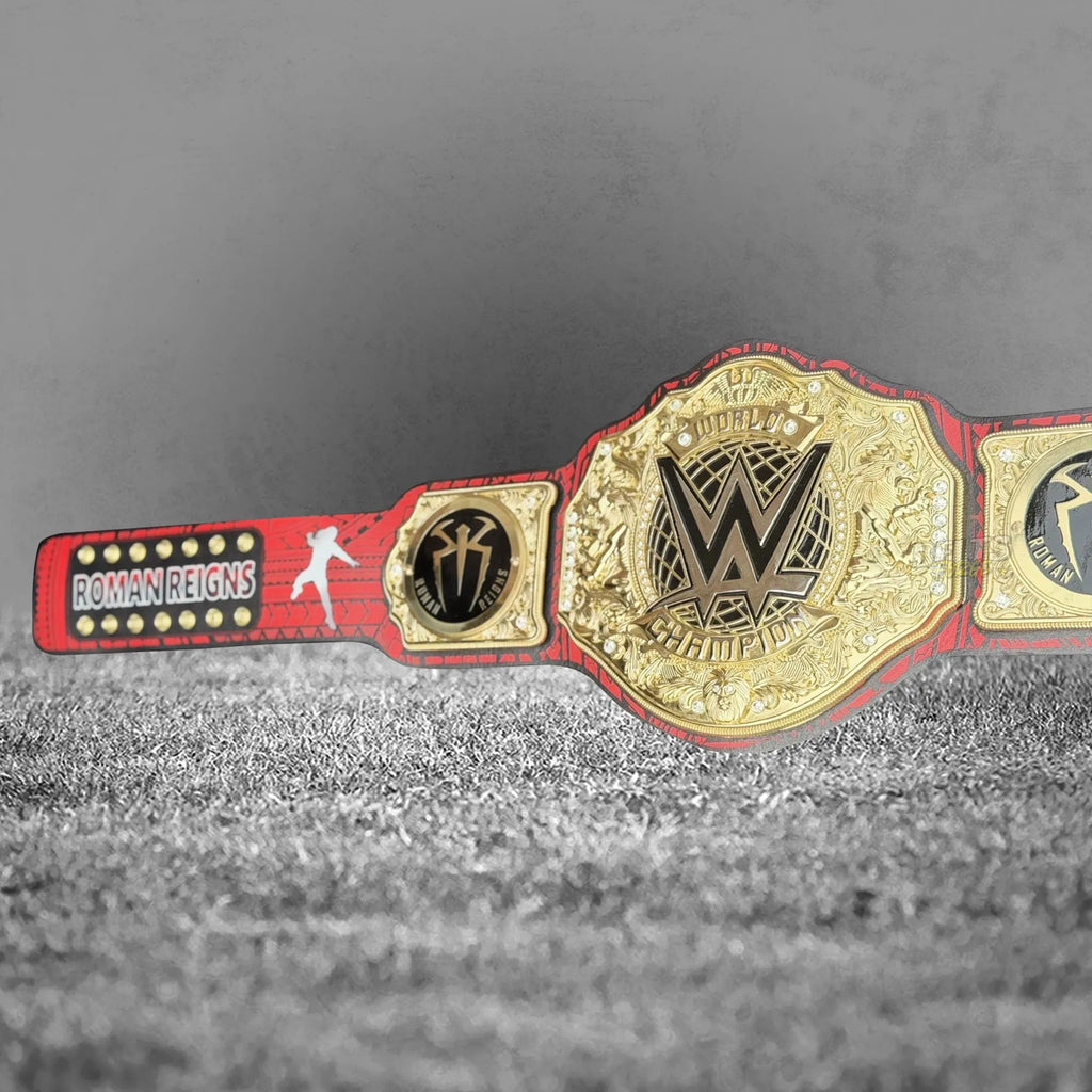 Roman Reigns Head of the Table championship belt strap detail showing custom tribal print on genuine leather with gold hardware