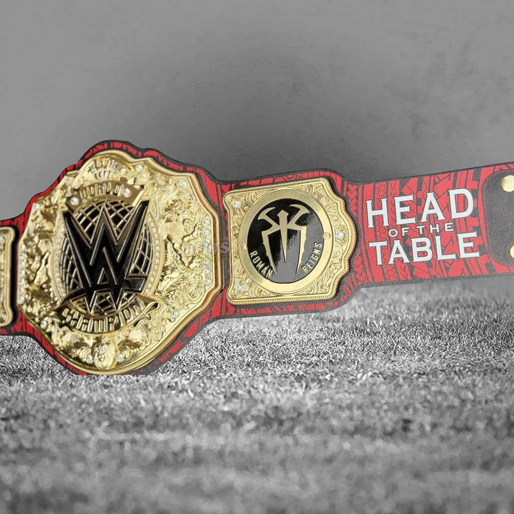 Roman Reigns championship belt strap tip back detail showing printed tribal leather and brass hardware close-up