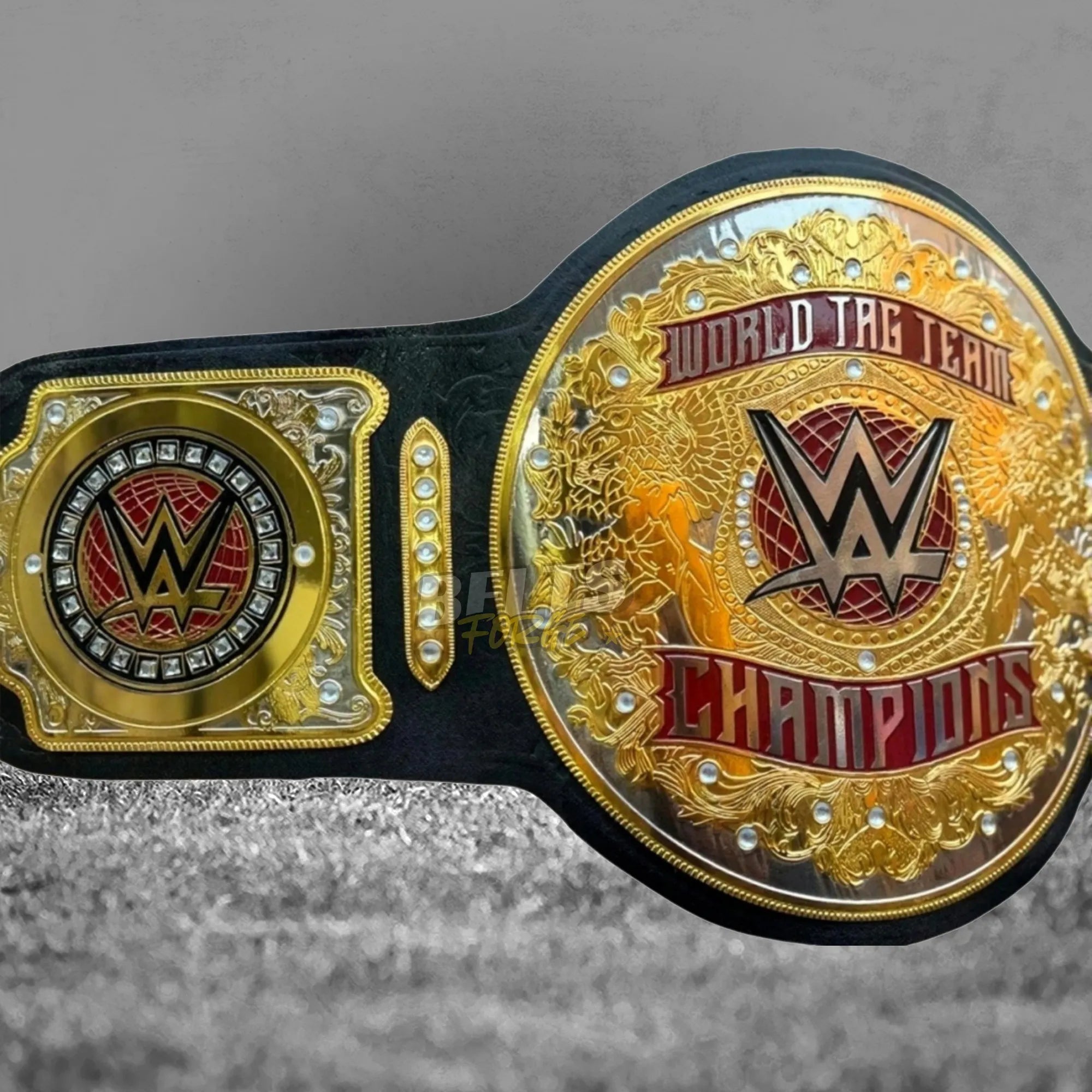 World Tag Team Championship Belt angled display view showing gold-plated brass plates and genuine leather strap profile