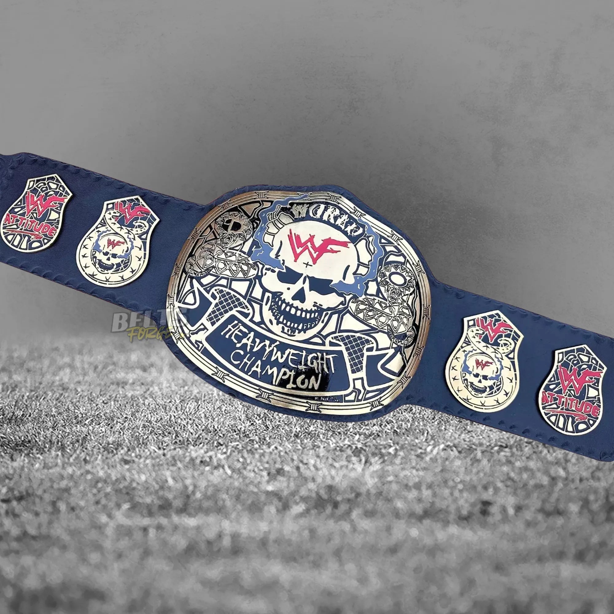 Skull Era Heavyweight Championship Belt front view angled display showing gold-plated brass skull plate on genuine leather strap