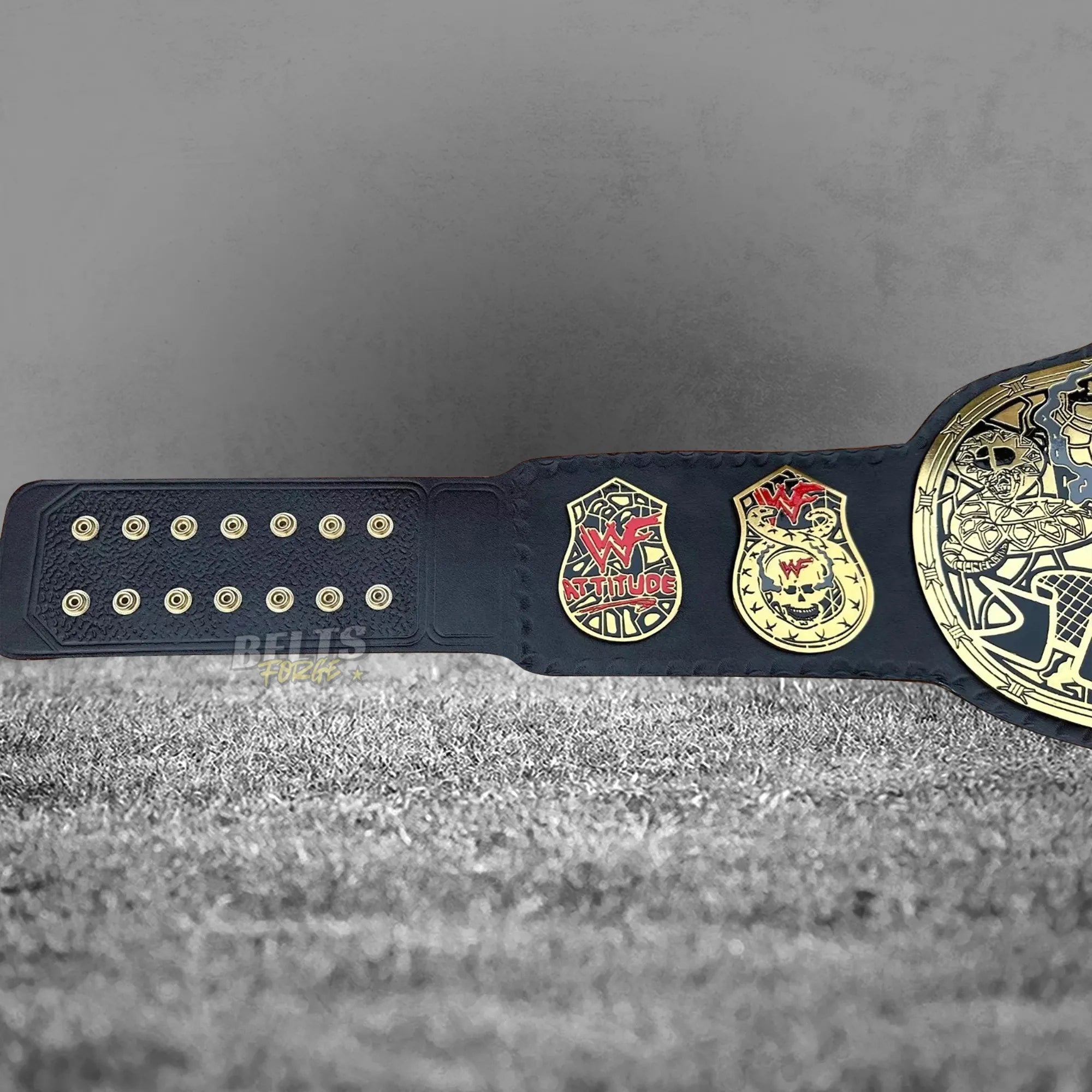Skull Era Heavyweight Championship Belt left strap back and side plates detail showing gold hardware on genuine leather