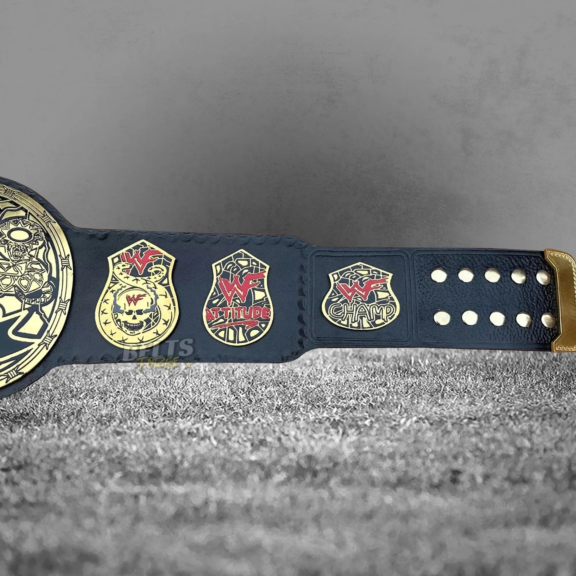 Skull Era Heavyweight Championship Belt right strap side plates and buckle detail showing gold-plated brass on leather strap