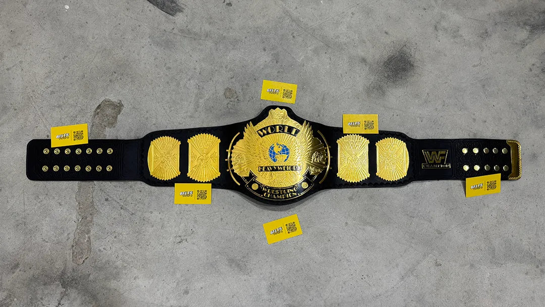 WWF Winged Eagle Championship Belt replica full flat lay view, brass gold plates on 52 inch black leather strap by Belts Forge
