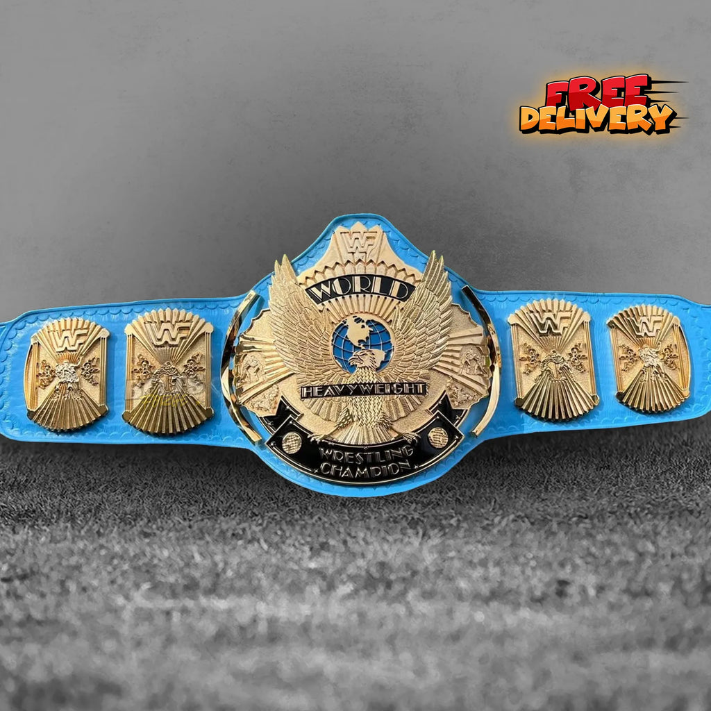 Winged Eagle Heavyweight Championship Belt replica front view, gold-plated brass eagle main plate on genuine blue leather strap by Belts Forge