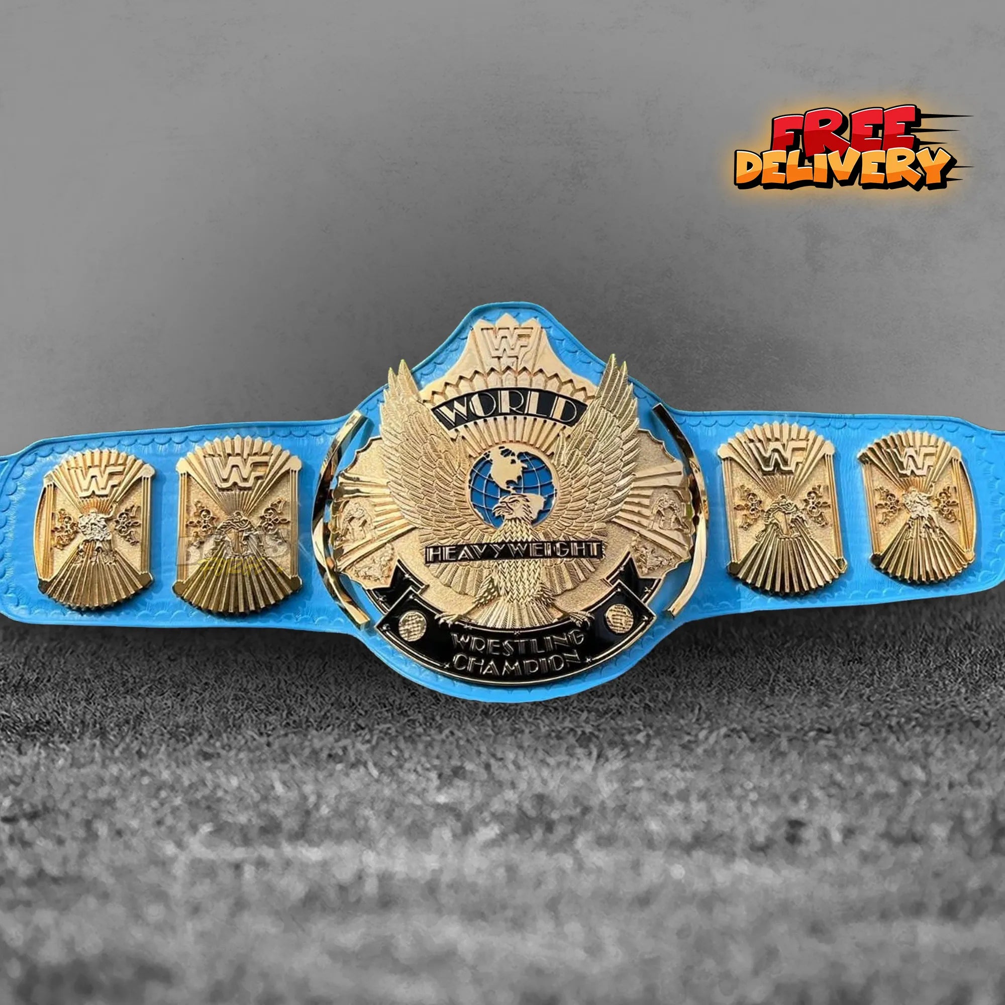 Winged Eagle Heavyweight Championship Belt replica front view, gold-plated brass eagle main plate on genuine blue leather strap by Belts Forge