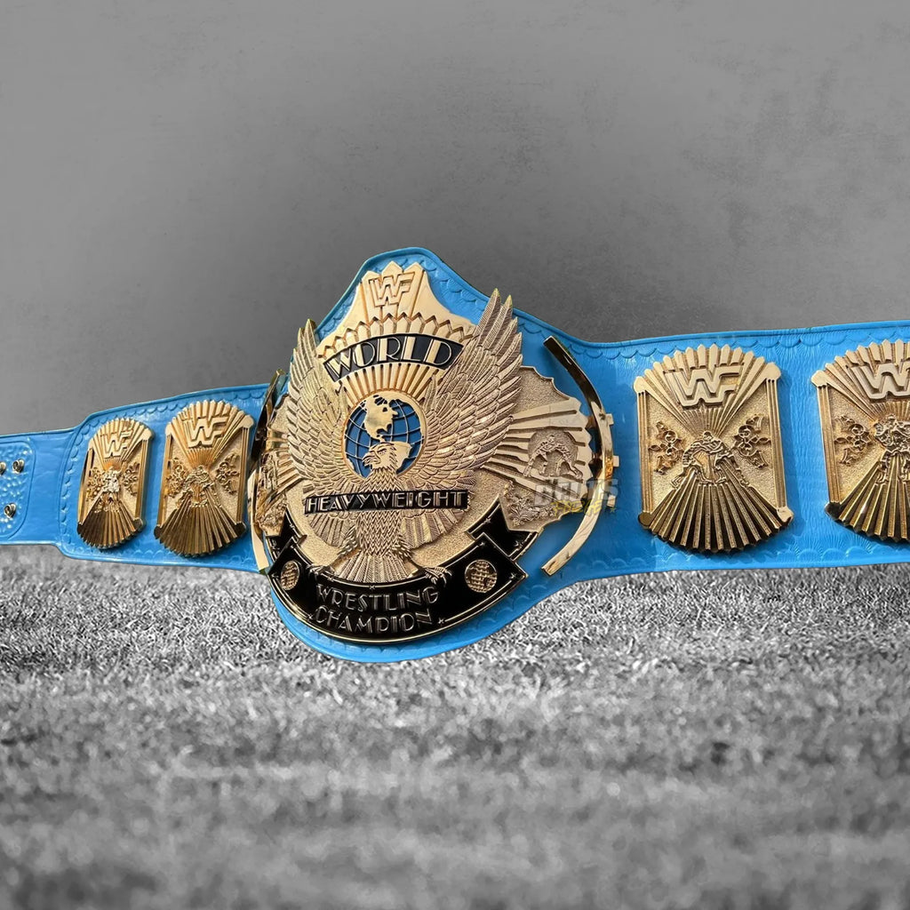 Winged Eagle Championship Belt full front view showing gold-plated eagle main plate and globe side plates on blue leather strap