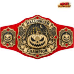 Halloween Champion pumpkin belt with blue strap, gold castle and spiderweb detailing, shown against white.